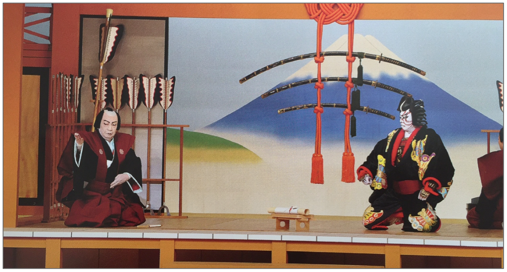 Guerrero protagonista de la obra Yanone recibiendo la visita de su amigo, músico. (Foto tomada del libro-programa de mano que compré en el teatro Kabuki-za).